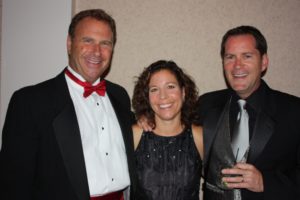 Hosts Bill and Dana Halle with auctioneer Russ Stolnack