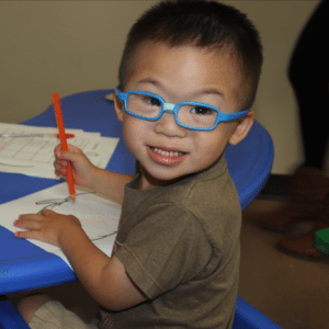 child-with-blue-glasses